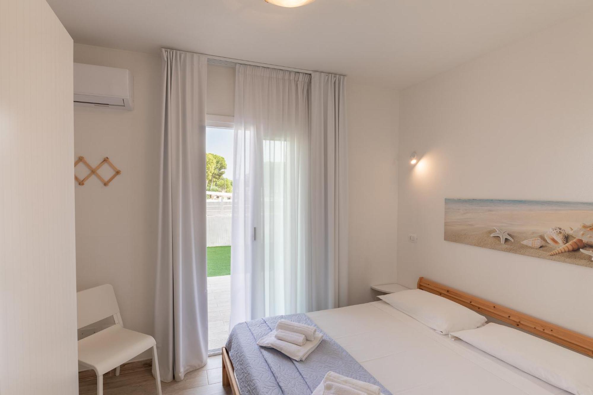 Case Vacanze "Bianco Mare" Porto Pino Δωμάτιο φωτογραφία