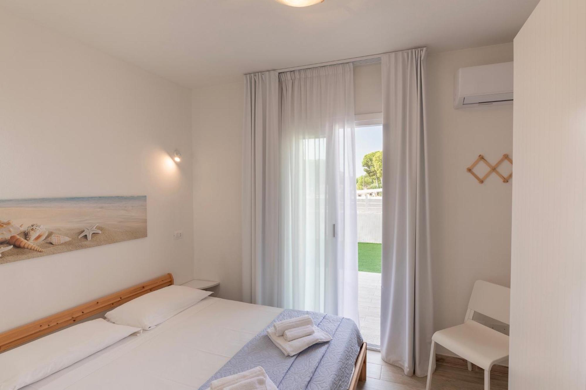 Case Vacanze "Bianco Mare" Porto Pino Δωμάτιο φωτογραφία
